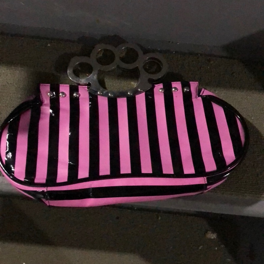 Pink and black knuckle purse